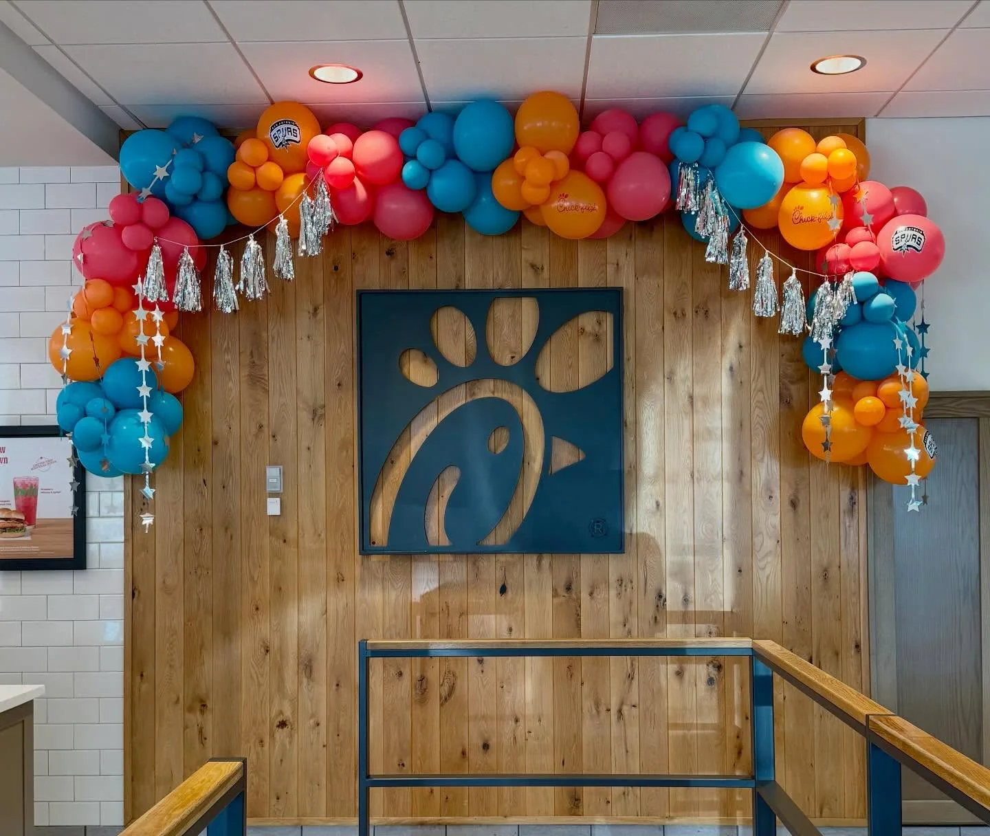 Orange, blue and pink Chick-fil-A balloon garland
