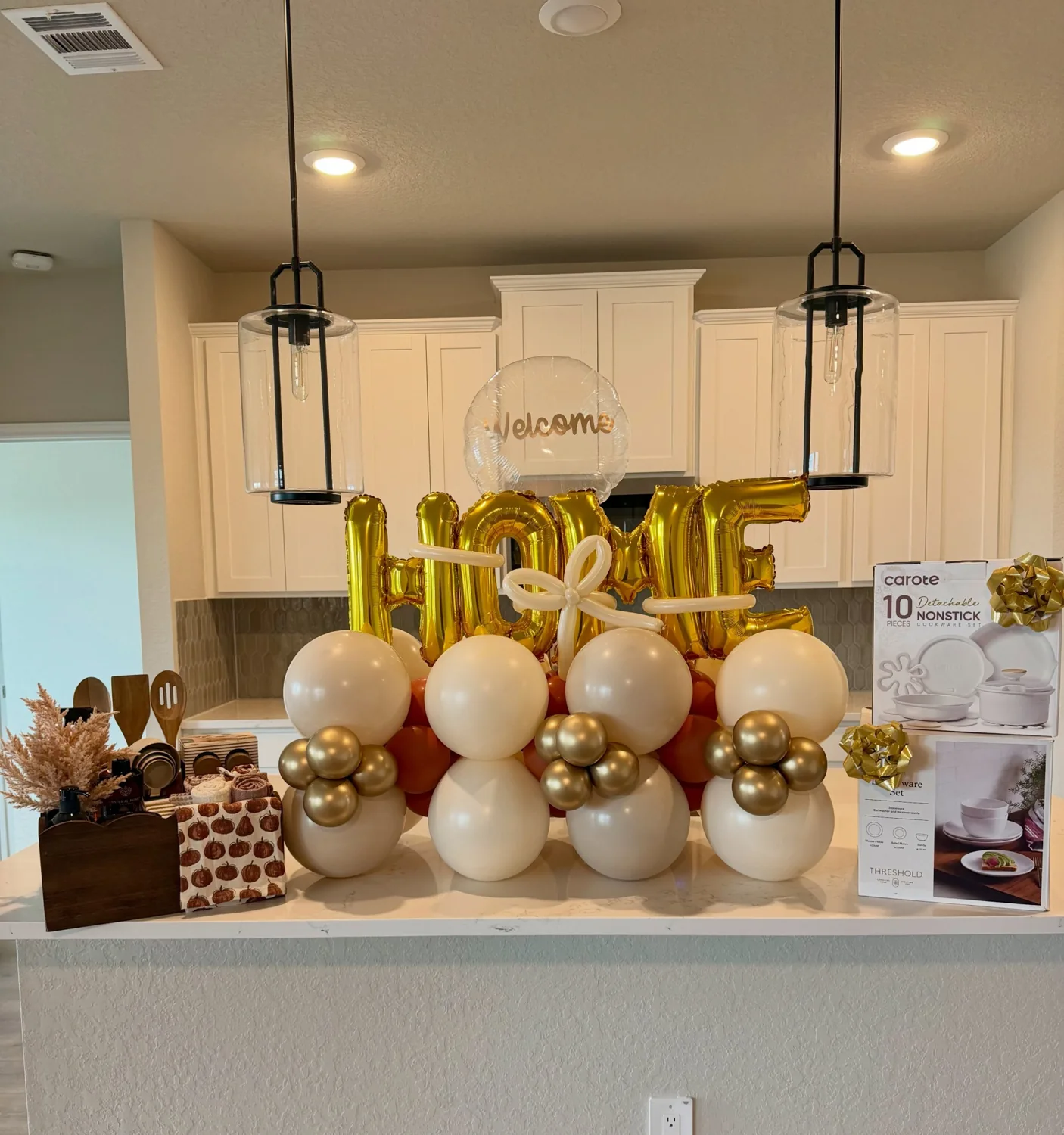 Gold and white Welcome Home custom balloon display